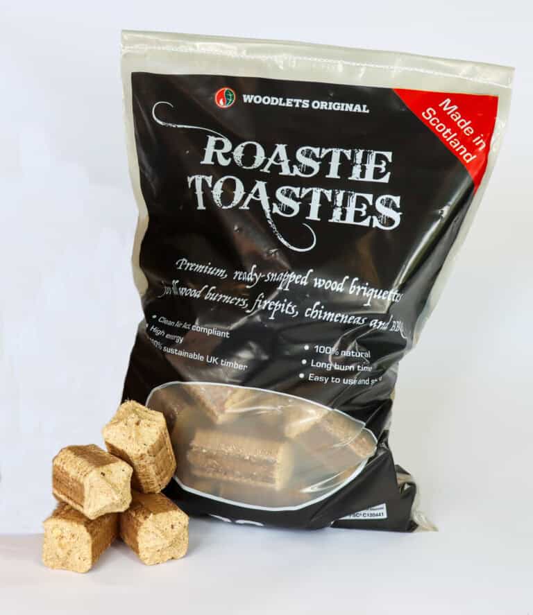 The Roastie Toastie product in its bag with four briquettes stacked beside the bag